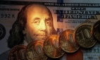 Доллар упал ниже 55 рублей впервые за неделю